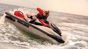 Sea-Doo RXT-X 325 2025 Sea-Doo RXT-X 325 jet ski speeding on ocean waves.