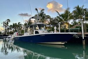 Solace 345 CC 2020 Solace 345 CC boat docked in a tropical marina at sunset.