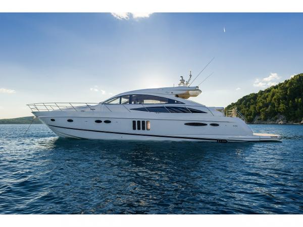 Princess V65 2009 Princess V65 yacht cruising on serene blue waters under a clear sky.