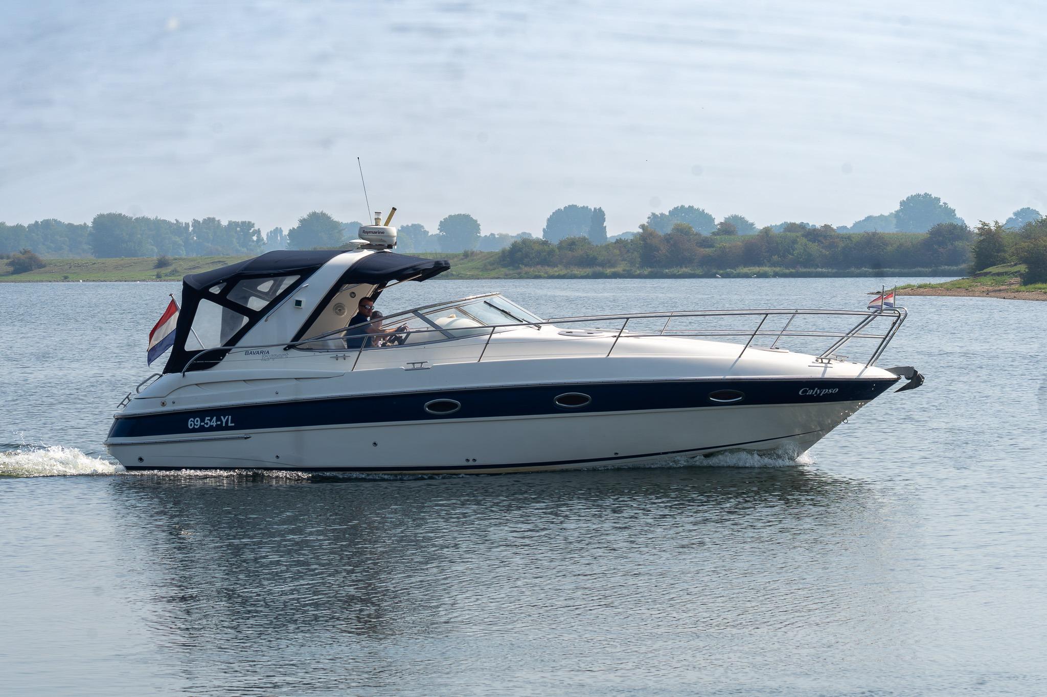 Bavaria Sport 32 2006 Bavaria Sport 32 yacht cruising on a calm river with scenic background.
