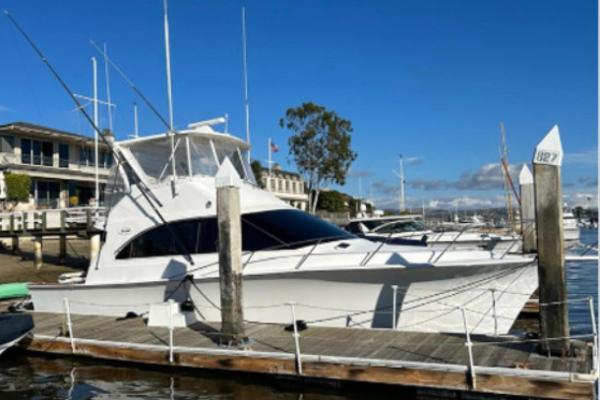 Ocean Yachts 42 Super Sport 1995 Ocean Yachts 42 Super Sport docked at marina under clear blue sky.