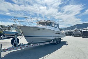 Cutwater C-32 Coupe 2026 Cutwater C-32 C boat on trailer under a clear blue sky.