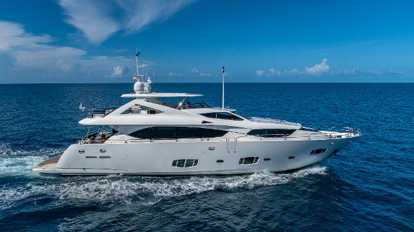 Sunseeker Flybridge 2010 Sunseeker Flybridge yacht cruising on open sea under clear blue sky.