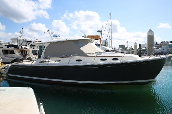 Back Cove 39O 2022 Back Cove 39O boat docked in marina under clear sky.