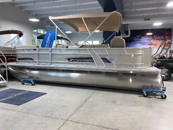 Starcraft EX22 FD 2024 Starcraft EX22 FD pontoon boat in showroom with canopy.