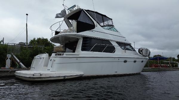 Carver 450 Voyager 1999 Carver 450 Voyager yacht docked on a cloudy day.