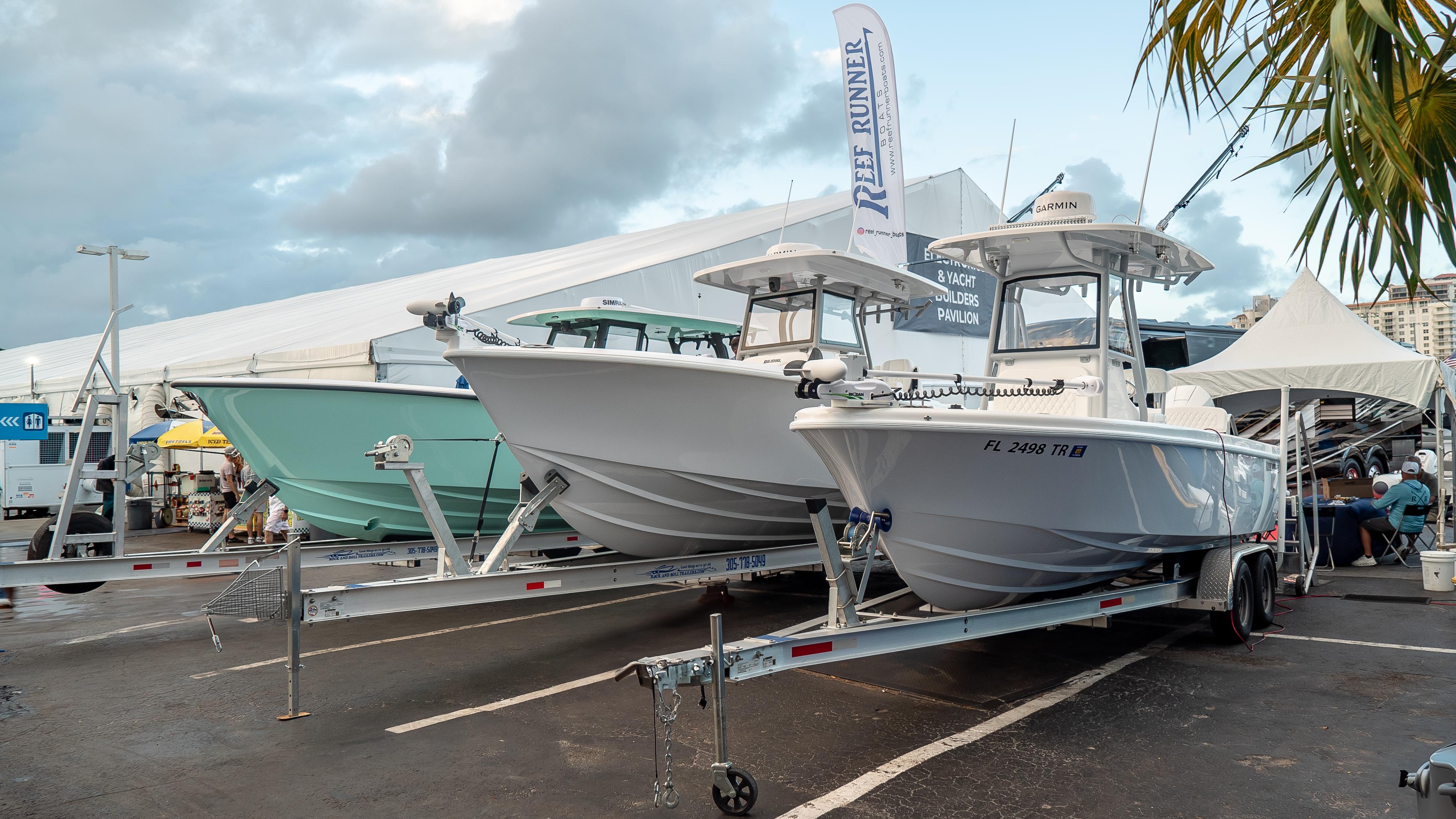Reef Runner 230 C Open 2026 Reef Runner 230 C Open boats on display at a marine exhibition.