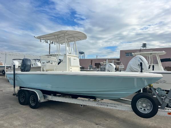 Pathfinder 2200 TRS 2025 Pathfinder 2200 TRS boat on trailer, parked outdoors under cloudy sky.
