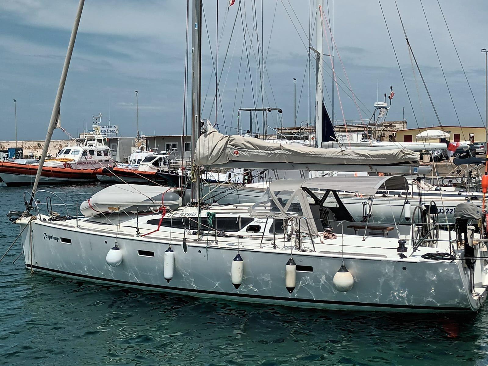 Wauquiez Opium 39 2011 Wauquiez Opium 39 sailboat docked in a marina, with clear skies.