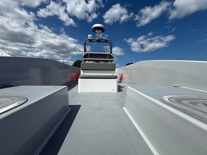 Custom T-33 PATROL Custom T-33 PATROL boat deck under blue sky with clouds, 2022 model.