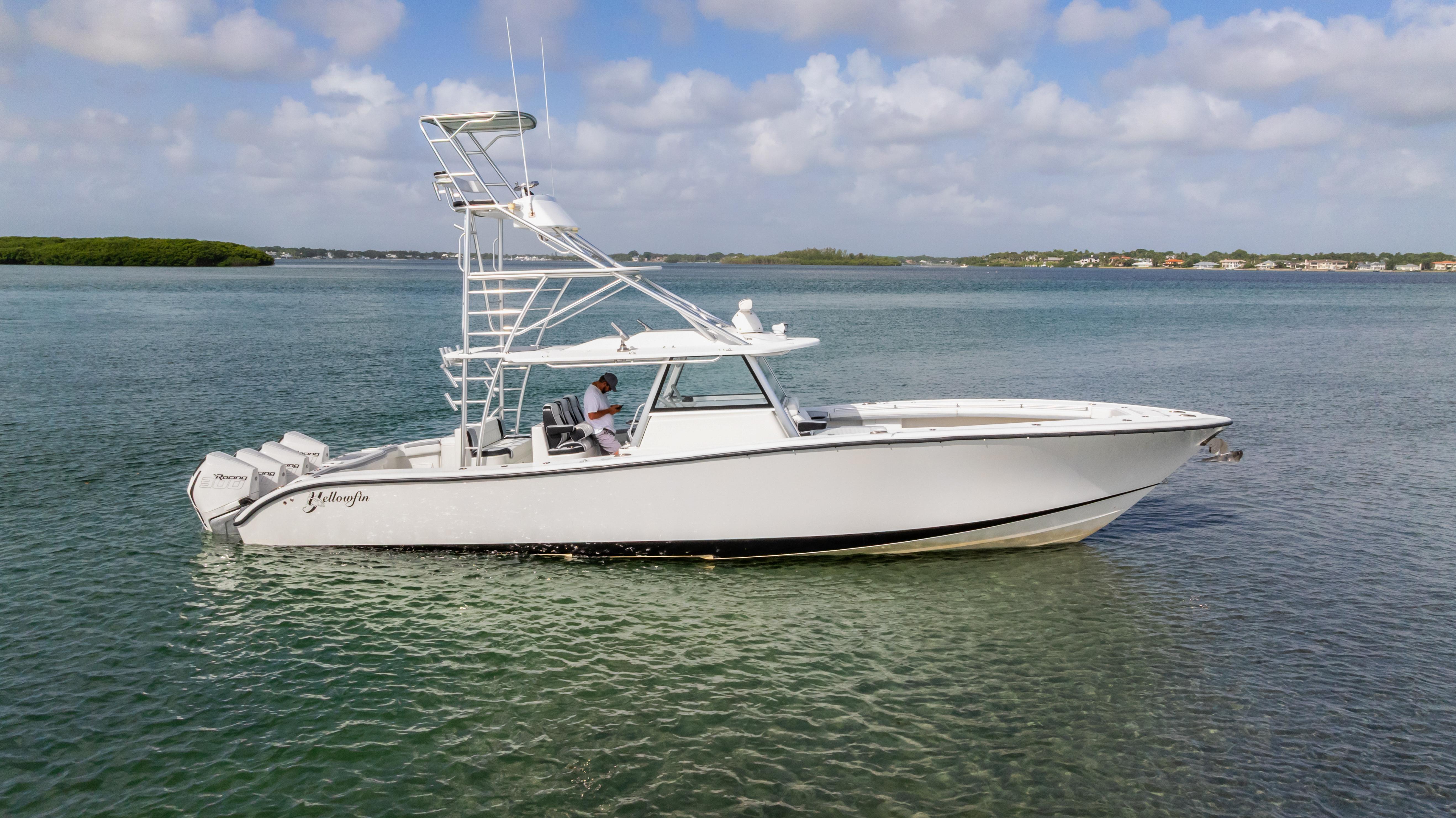 Yellowfin 42 Offshore 2018 Yellowfin 42 Offshore boat on calm water under a partly cloudy sky.