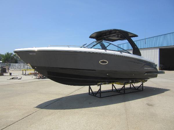 Chaparral 307 SSX 2025 Chaparral 307 SSX boat displayed outdoors on a stand.