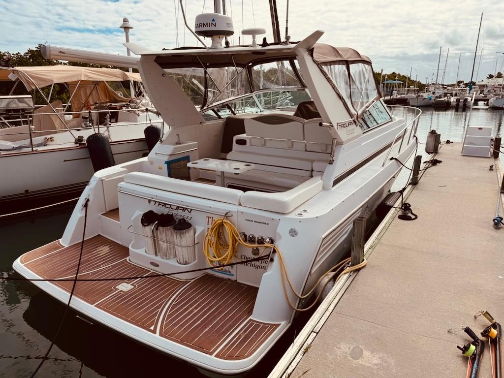 Trojan 40 Express Cruiser 1998 Trojan 40 Express Cruiser docked at marina, featuring spacious deck and modern amenities.