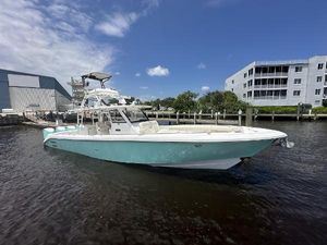 Everglades 435 Center Console 2017 Everglades 435 Center Console boat docked in marina under clear blue sky.
