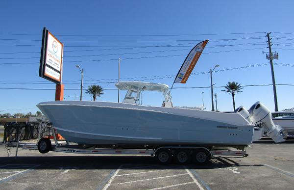 Twin Vee 340 GFX CC 2023 Twin Vee 340 GFX CC boat on trailer in parking lot.