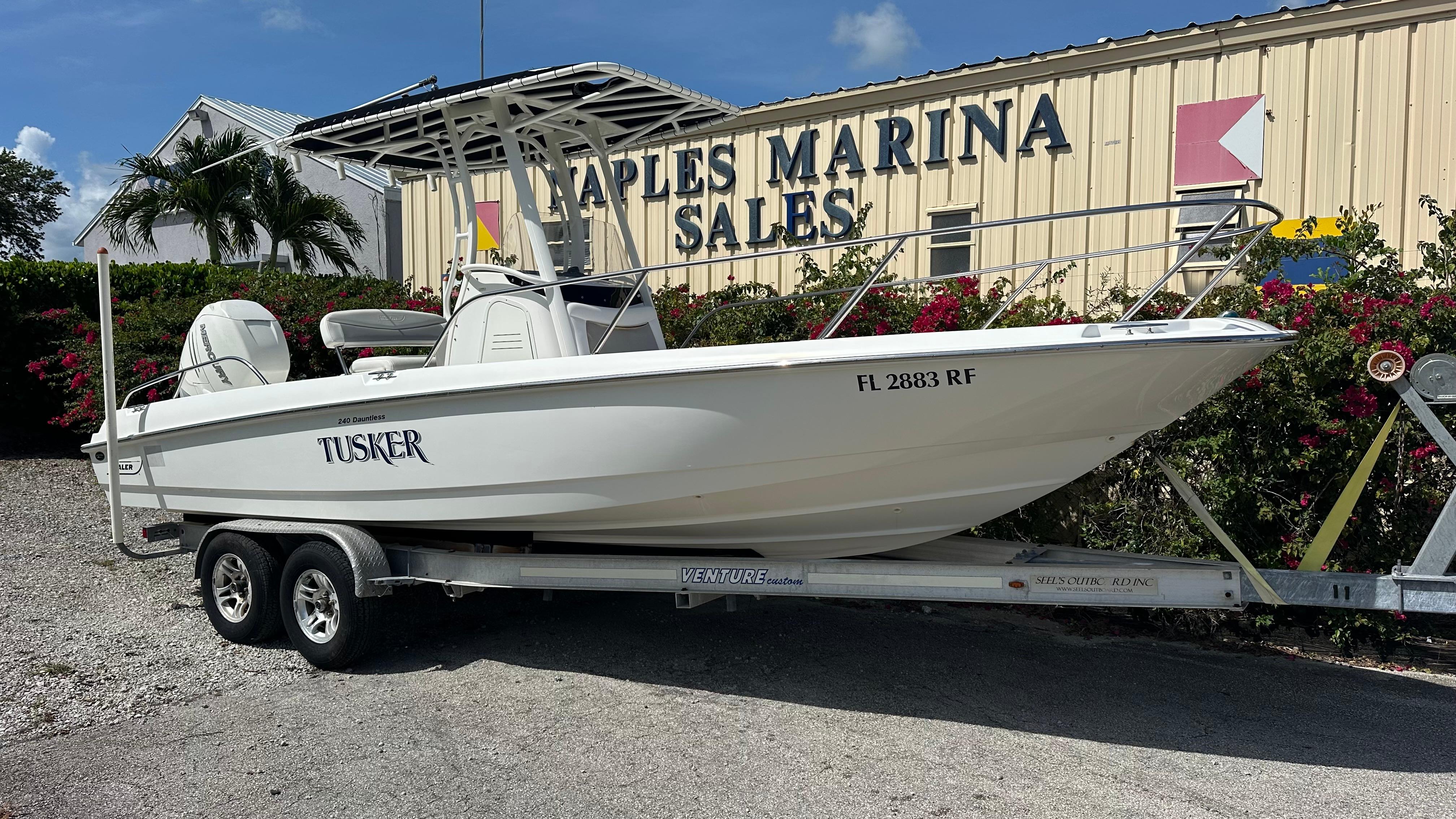 Boston Whaler 240 Dauntless 2016 Boston Whaler 240 Dauntless boat on trailer at Naples Marina Sales.