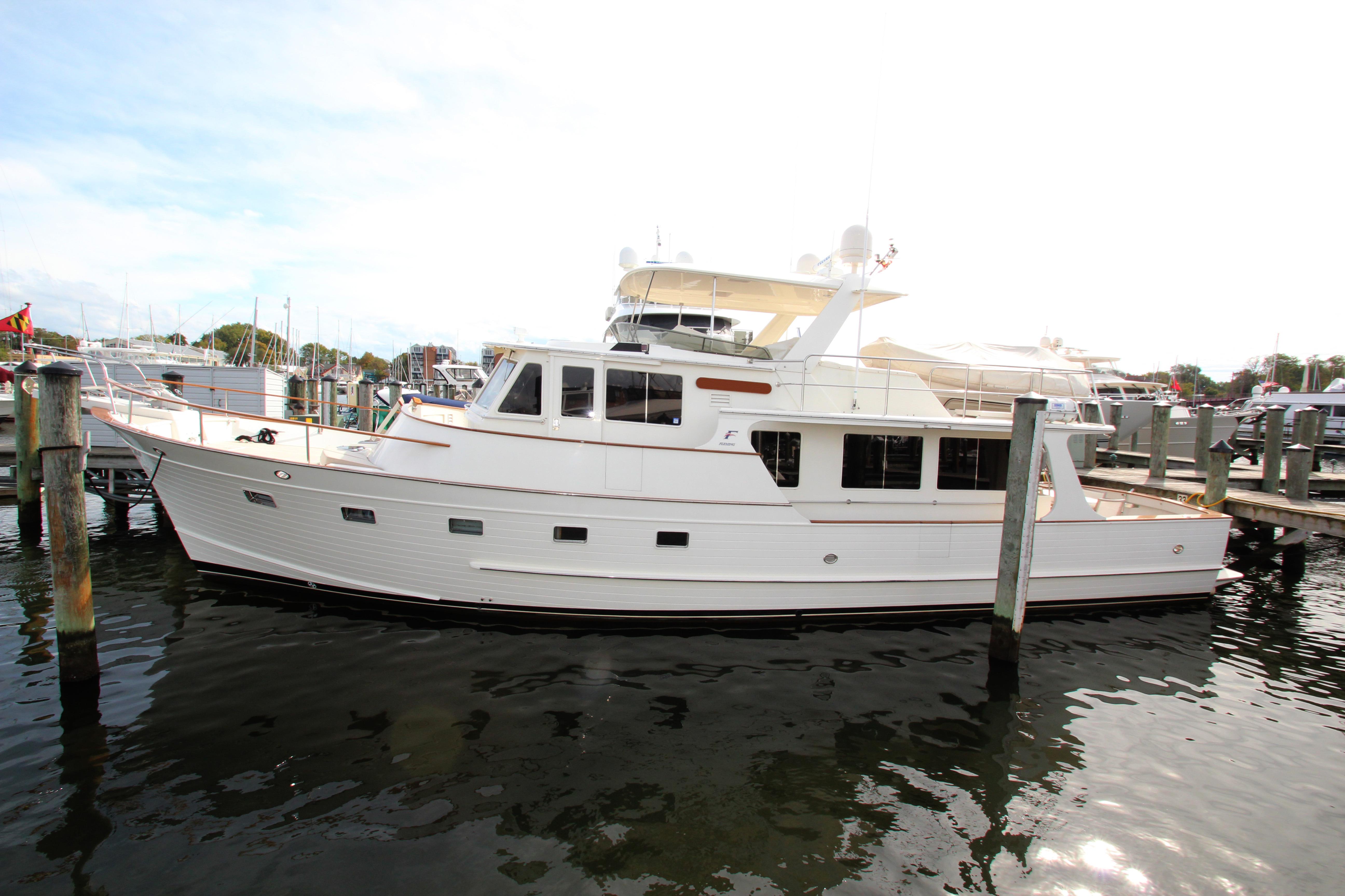 Fleming 55 2001 Fleming 55 yacht docked at marina, side view.
