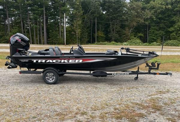 Tracker Pro Team 190 2025 Tracker Pro Team 190 boat on trailer, parked outdoors.