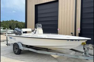 Pathfinder 1806 V 2000 Pathfinder 1806 V boat on trailer, parked outside a building.