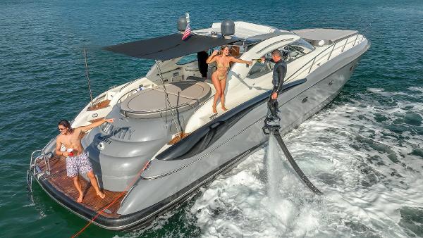 Sunseeker Predator 58 Sunseeker Predator 58 yacht, 1999 model, with people enjoying water activities.