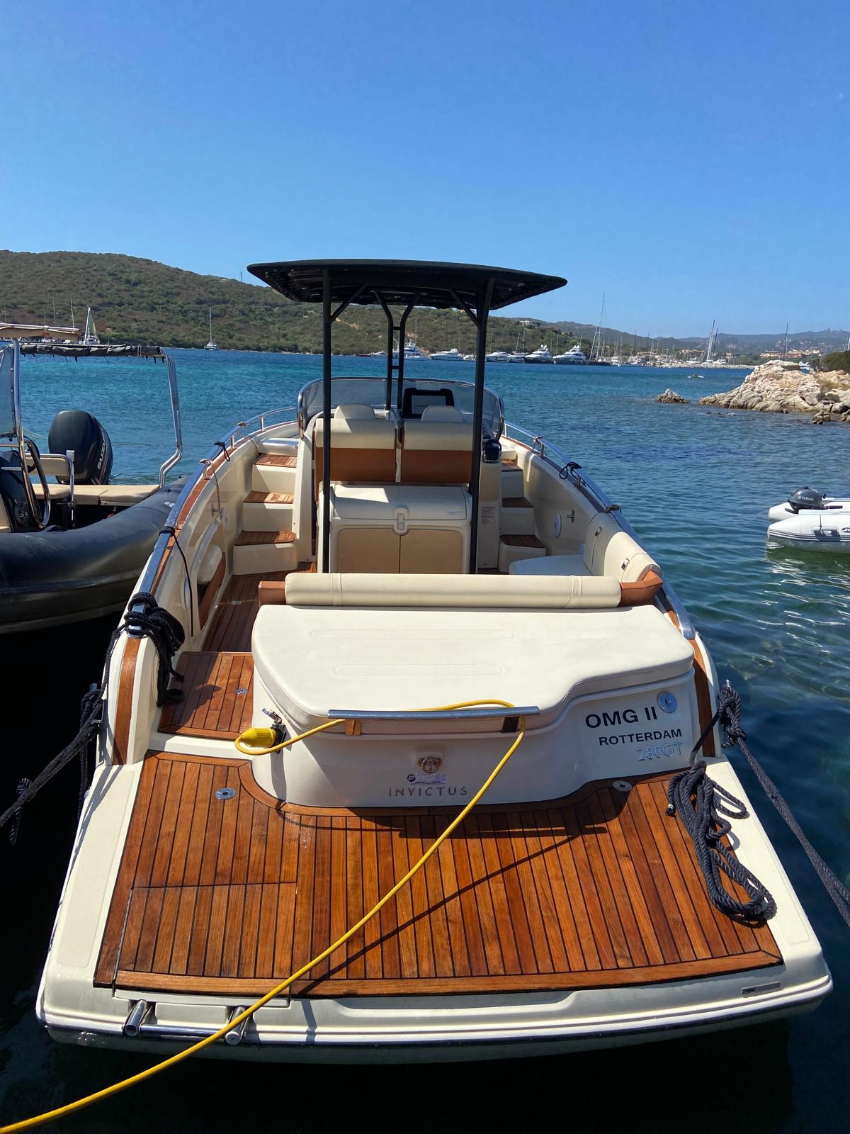 Invictus GT280 2017 Invictus GT280 boat docked in a scenic harbor.