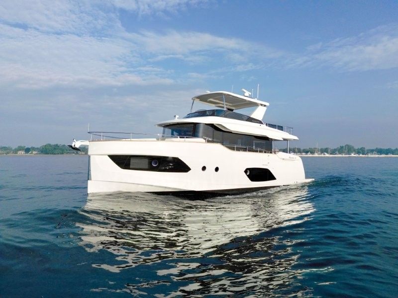 Absolute 58 Navetta 2026 Absolute 58 Navetta yacht cruising on calm waters under a clear sky.