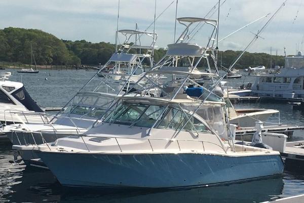 Grady-White Express 360 2006 Grady-White Express 360 boat docked in a marina, featuring a sleek design.