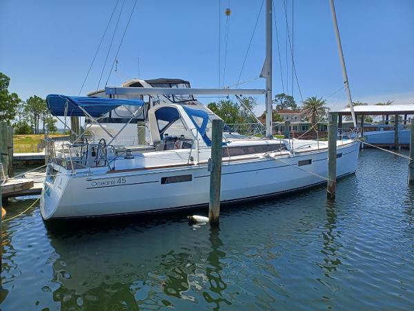 Beneteau Oceanis 45 2013 Beneteau Oceanis 45 sailboat docked in a marina under clear blue skies.