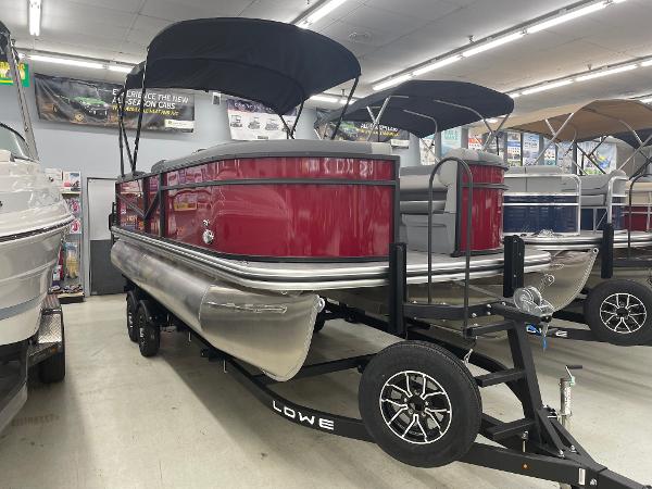 Lowe Ls-210 2025 Lowe LS210 pontoon boat with red exterior on display in showroom.