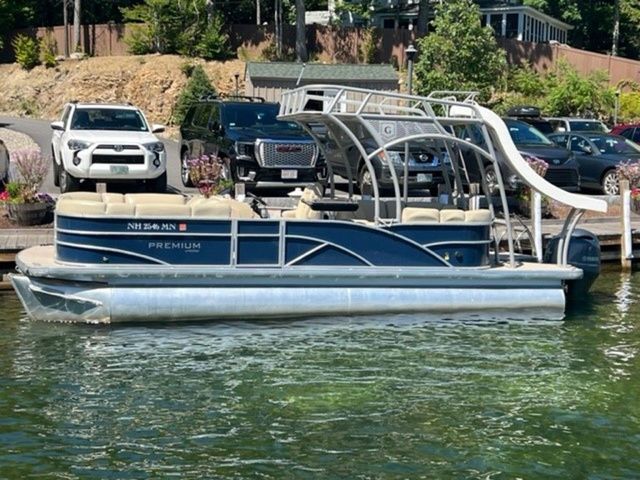 Godfrey Marine SWPE 255 WB TT-25 2019 Godfrey Pontoons SWPE 255 WB TT-25 docked, featuring a sleek design and slide.