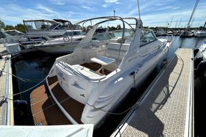 Sea Ray 330 Sundancer 1997 Sea Ray 330 Sundancer docked at marina, showcasing sleek design and spacious deck.