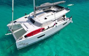 Fountaine Pajot Elba 45 Fountaine Pajot Elba 45 catamaran sailing in clear turquoise waters, 2022 model.