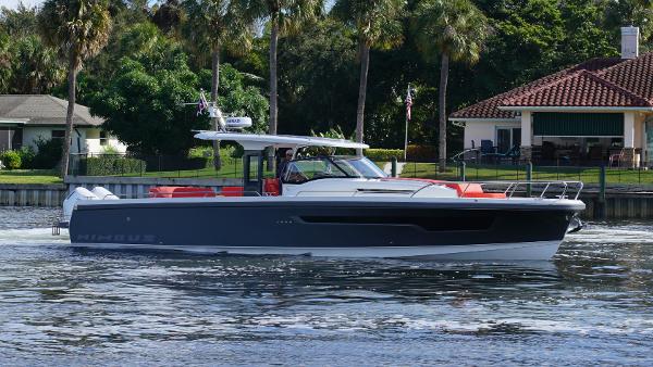Nimbus Tender 11 #260 2024 Nimbus Tender 11 #260 cruising on a scenic waterway near lush greenery.