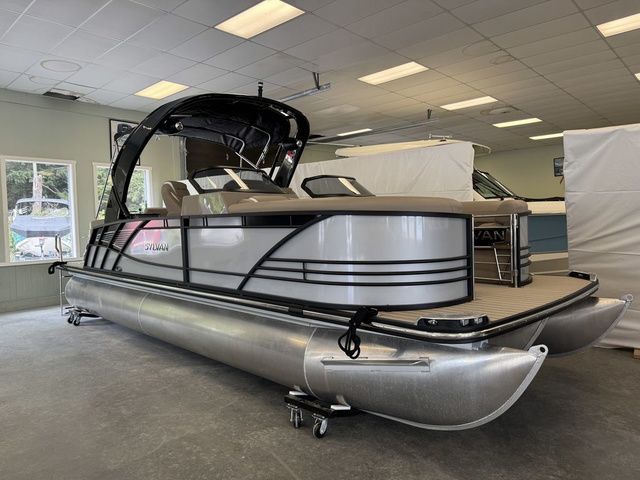 Sylvan S3 DLZ DC 2024 Sylvan S3 DLZ DC pontoon boat in showroom, featuring sleek design and modern amenities.