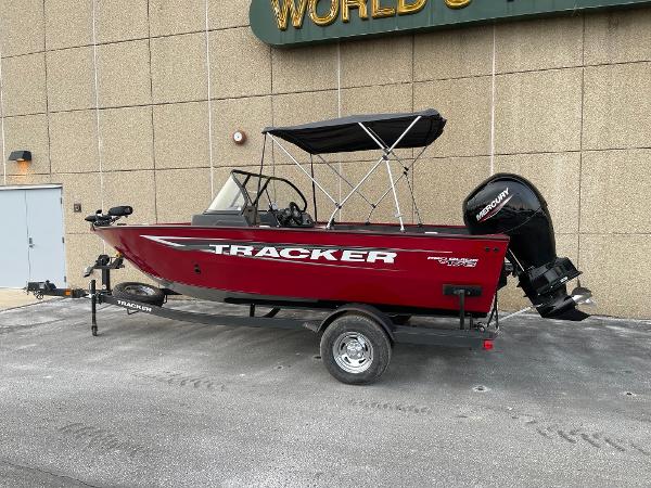 Tracker Pro Guide V-175 Combo 2025 Tracker Pro Guide V-175 Combo boat with canopy on trailer, parked outdoors.
