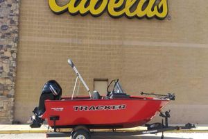 Tracker Pro Guide V-175 Combo 2026 Tracker Pro Guide V-175 Combo boat displayed outside Cabela's store.