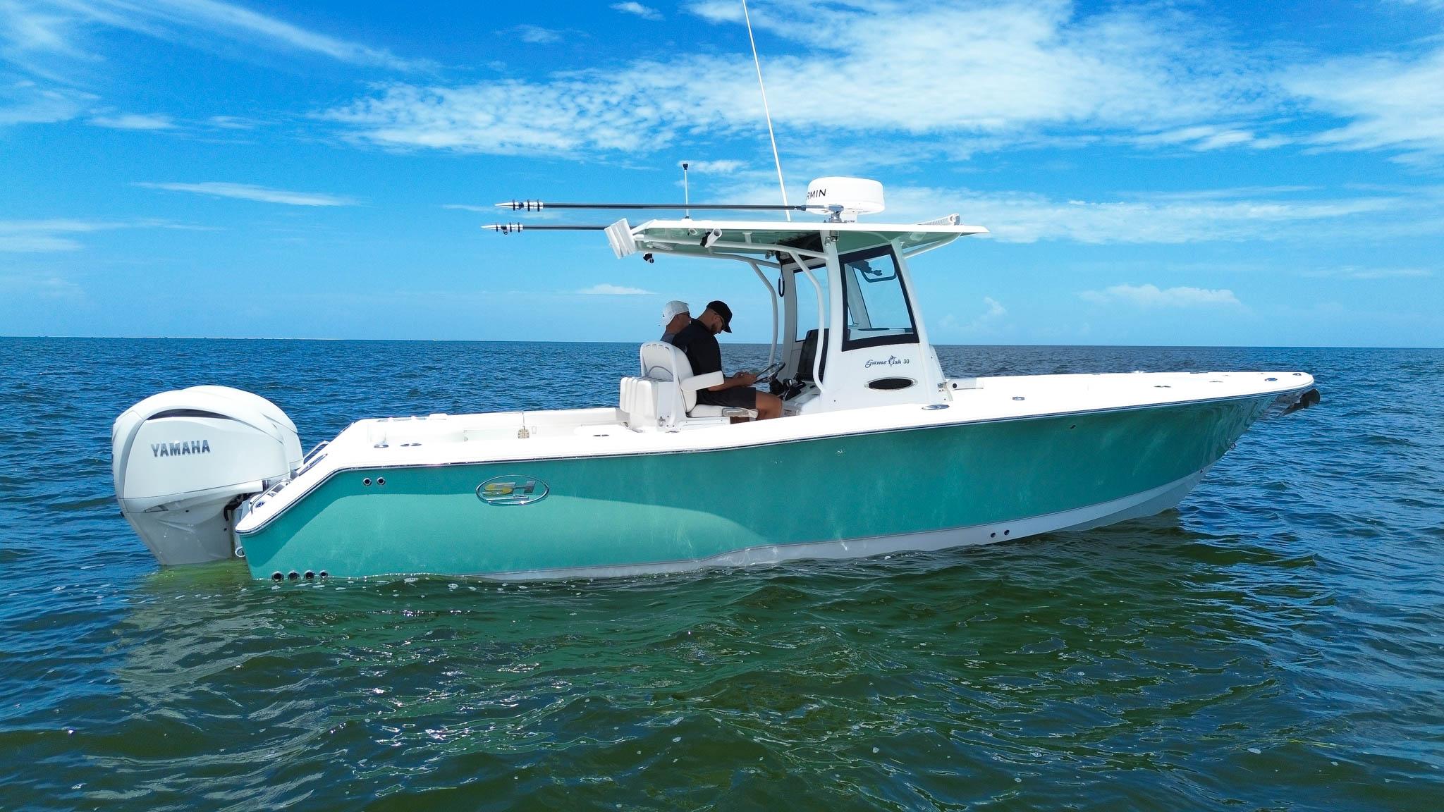 Sea Hunt Gamefish 30 Coffin Box 2023 Sea Hunt Gamefish 30 Coffin Box boat on open water, featuring Yamaha engines.