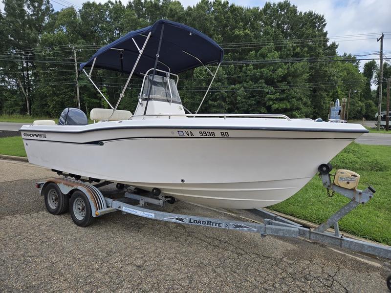 Grady-White Escape 209 2002 Grady-White 209 ESCAPE boat on Load Rite trailer, parked outdoors.