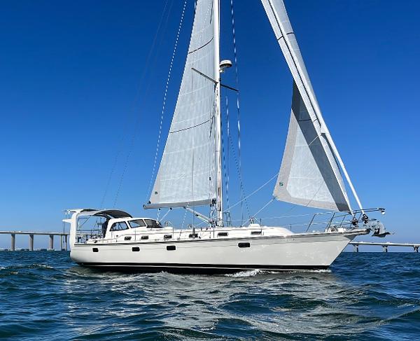 Island Packet 439 Sailing yacht Island Packet 439, 2022 model, cruising on open water under clear blue skies.