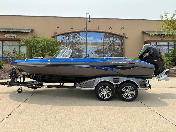Ranger 2080MS 2025 Ranger 2080MS boat on trailer, parked outdoors, side view.