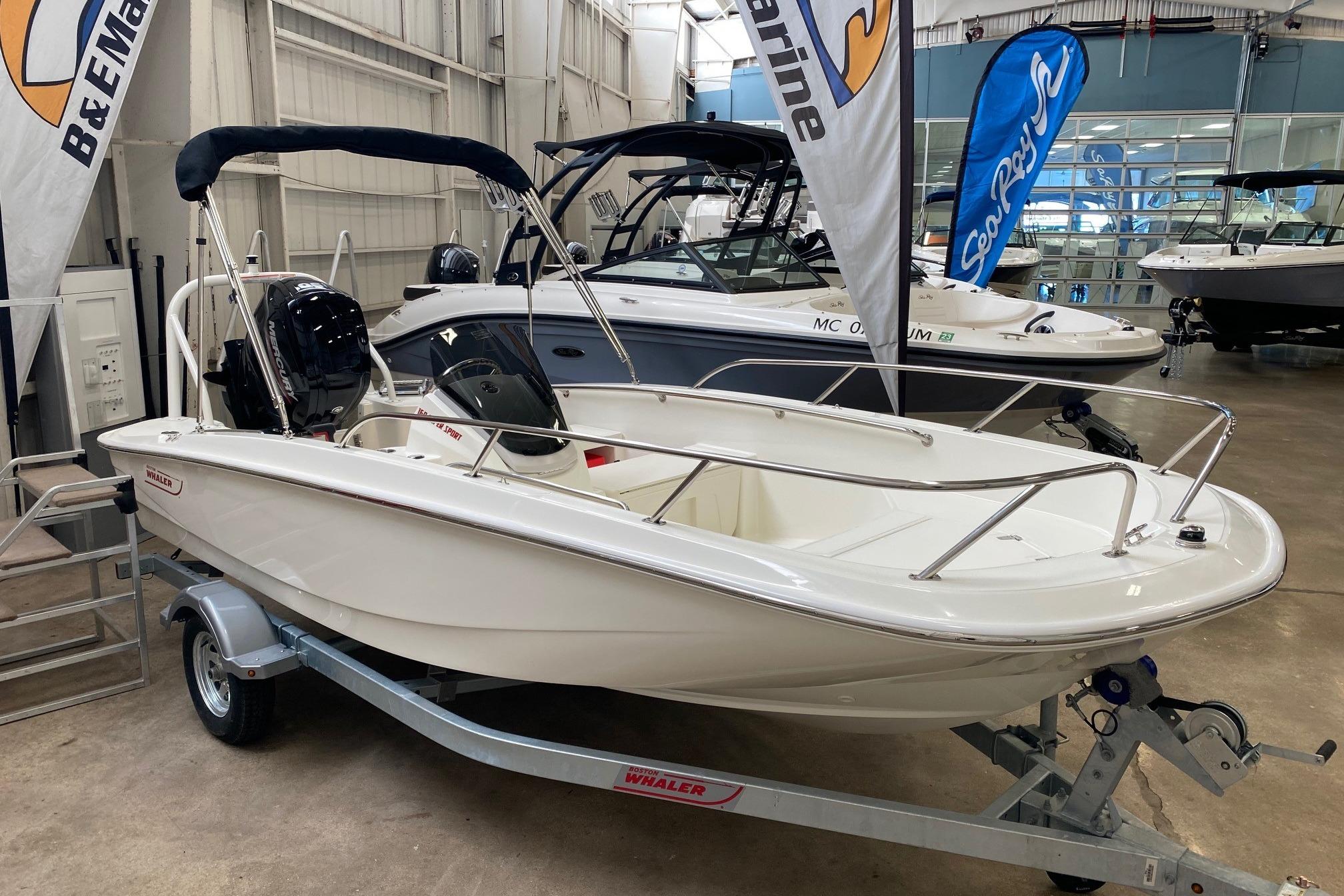 Boston Whaler 160 Super Sport 2021 Boston Whaler 160 Super Sport boat displayed in a showroom on a trailer.