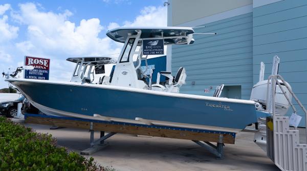 Tidewater 2500 Carolina Bay 2025 Tidewater 2500 Carolina Bay boat displayed at a marina, blue hull, clear sky background.