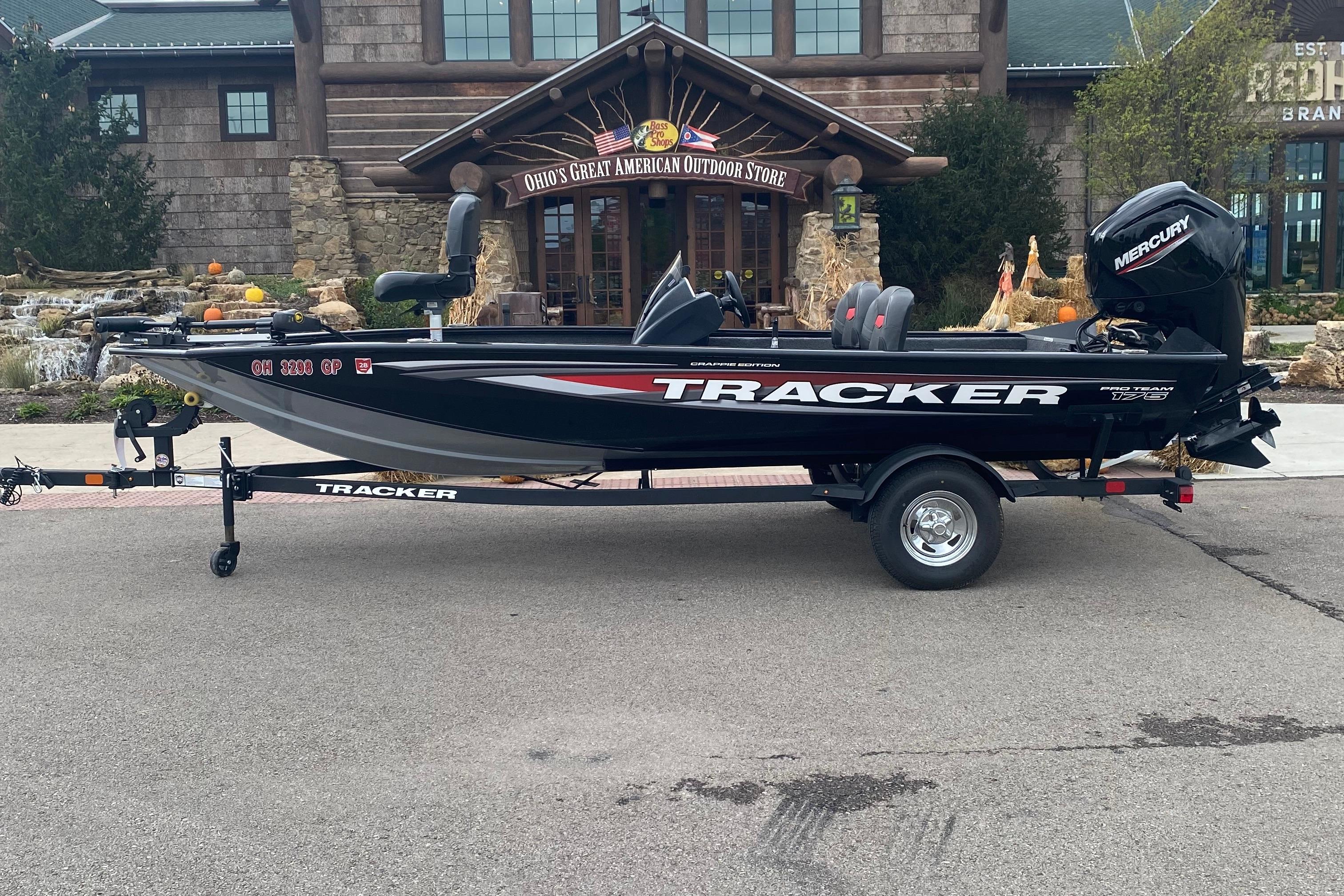 Tracker Pro Team 175 Crappie Edition 2025 Tracker Pro Team 175 Crappie Edition boat parked outside a rustic building.