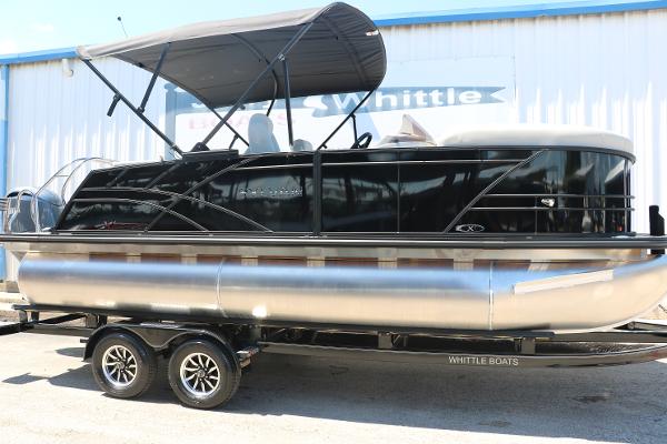Sylvan X1 CLZ DH Tri-Toon 2025 Sylvan X1 CLZ DH Tri-Toon boat on trailer with canopy.