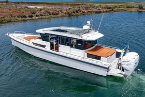Axopar Aft Cabin 2018 Axopar Aft Cabin boat cruising on a serene waterway.