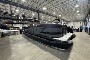 Sylvan Mirage X X3 CLZ 2026 Sylvan Mirage X X3 CLZ pontoon boat in a spacious warehouse setting.