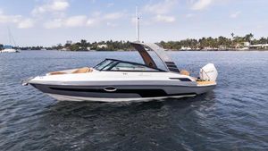 Hanover 255 2025 Hanover 255 boat on calm water, sleek design, sunny day, coastal background.