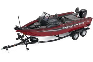 Tracker Targa V-18 Combo 2026 Tracker Targa V-18 Combo boat, red, on trailer, with seating and Mercury engine.
