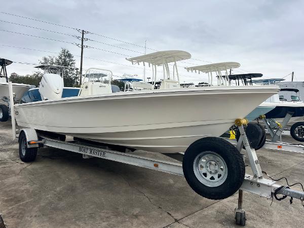 Hewes Redfisher 21 2025 Hewes Redfisher 21 boat on trailer, parked outdoors, overcast sky.