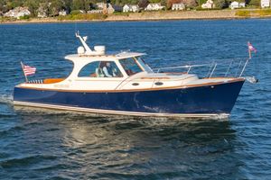 Hinckley Picnic Boat 37 MKIII 2015 Hinckley Picnic Boat 37 MKIII cruising on a scenic waterway.